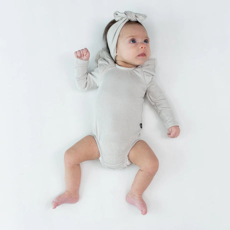 Kyte Baby Ribbed Long Sleeve Ruffle Leotard in Oat